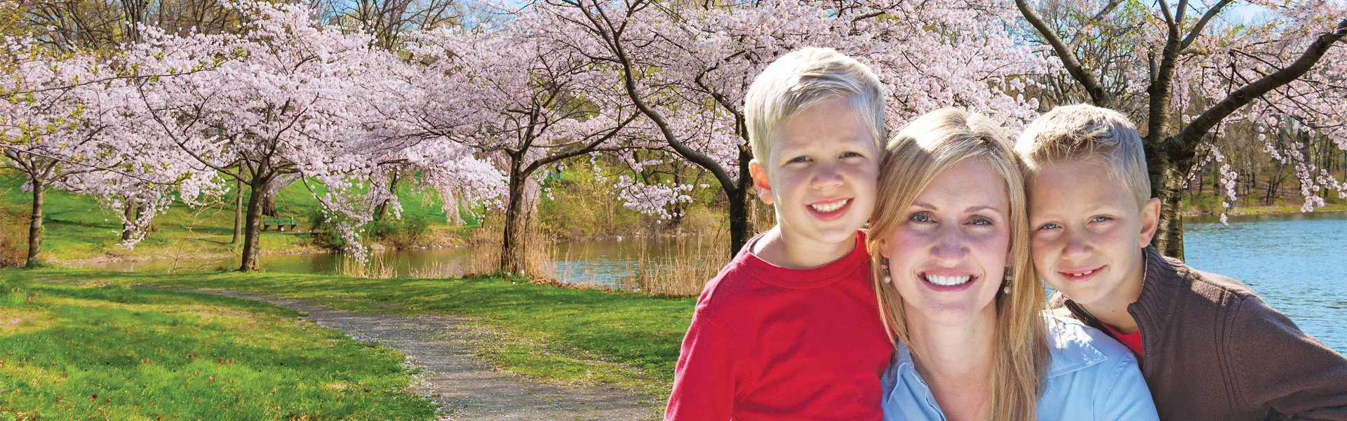 mother and sons in flowering trees landscape